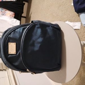 Michael kors backpack ***I NOTICED A FEW DARK SPOTS ON BAG !